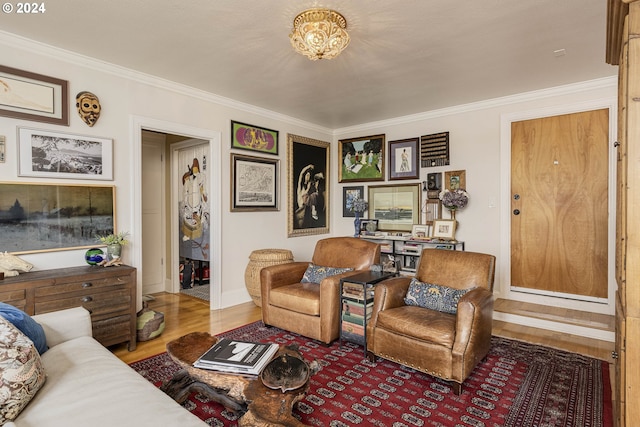 living room featuring hardwood / wood-style floors and ornamental molding