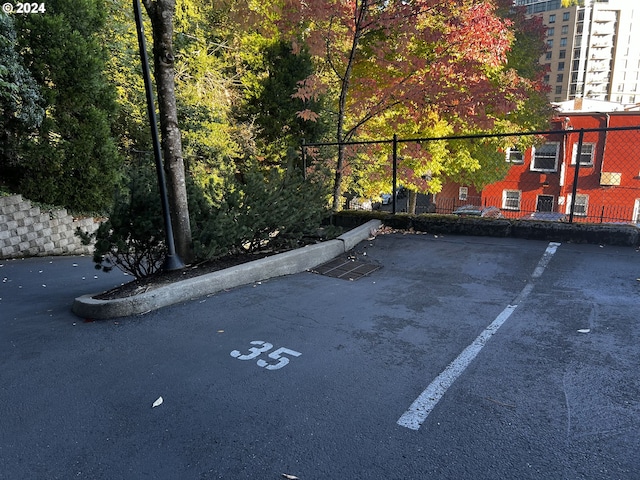 uncovered parking lot with fence