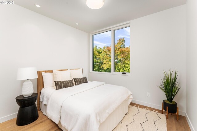 bedroom with light wood-type flooring