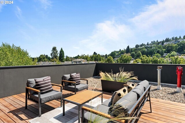 deck featuring outdoor lounge area