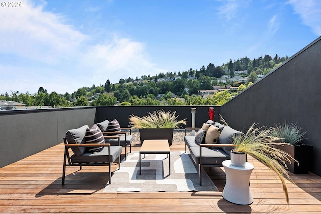 wooden terrace with outdoor lounge area