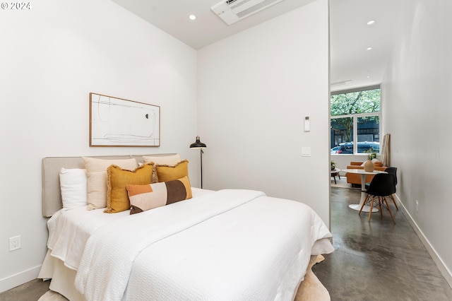 bedroom featuring concrete flooring, recessed lighting, visible vents, and baseboards