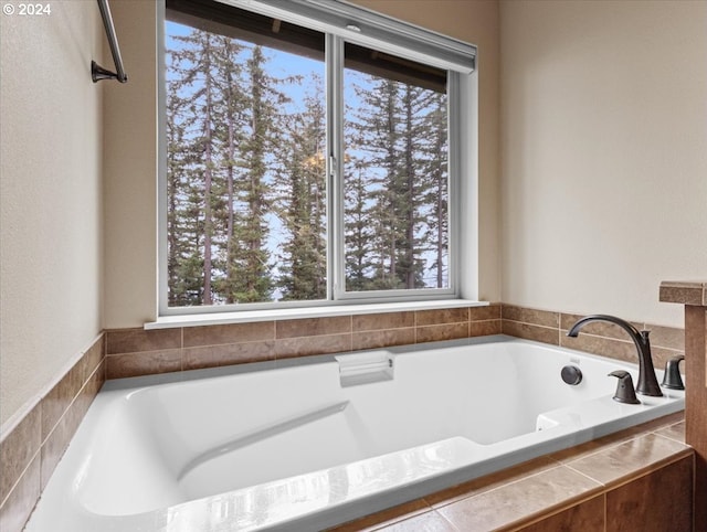 bathroom featuring tiled bath