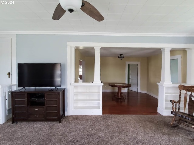 living room with ornate columns, crown molding, and carpet floors