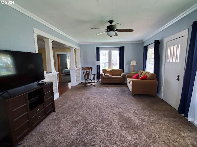 carpeted living room featuring ornate columns, ceiling fan, and ornamental molding