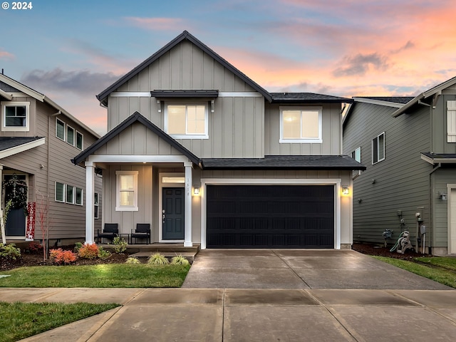 view of front facade featuring a garage, concrete driveway, a porch, and board and batten siding