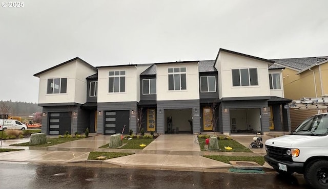 view of front of property with stucco siding and an attached garage