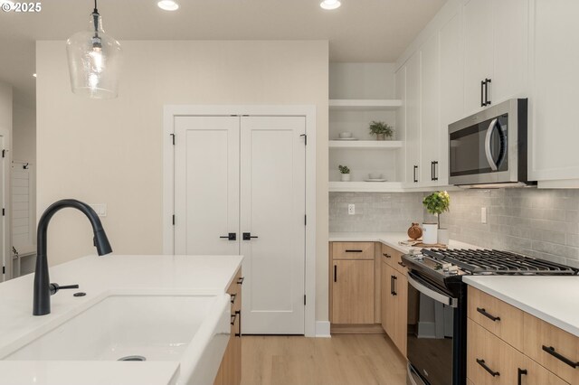 walk in closet featuring a sink