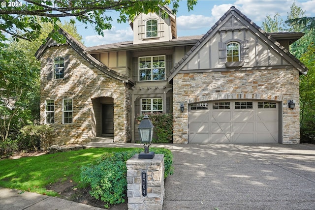 english style home with a garage