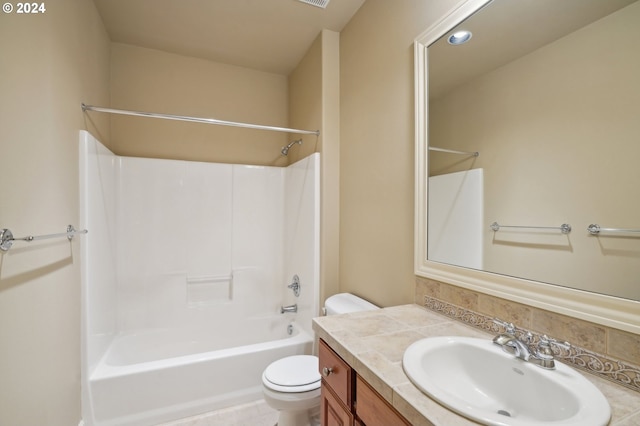 full bathroom with shower / washtub combination, backsplash, vanity, tile patterned flooring, and toilet