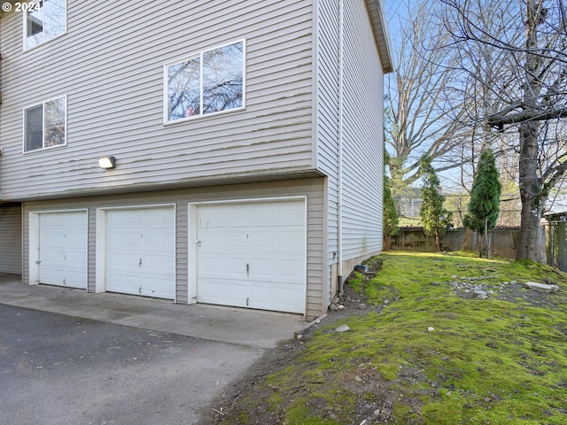 garage featuring a yard