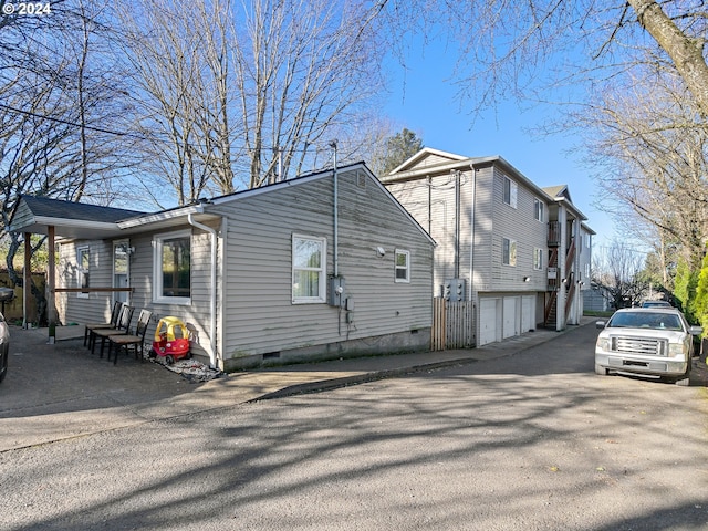 view of property exterior featuring a garage