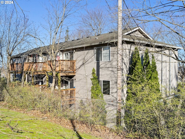 view of side of home featuring a deck