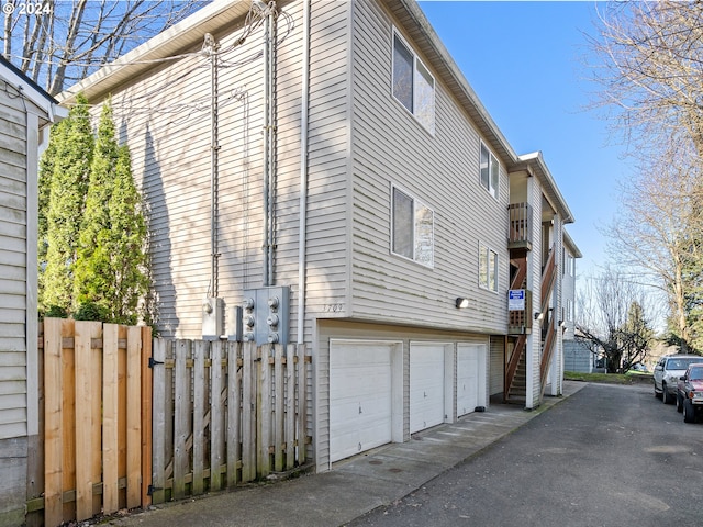 view of side of home with a garage