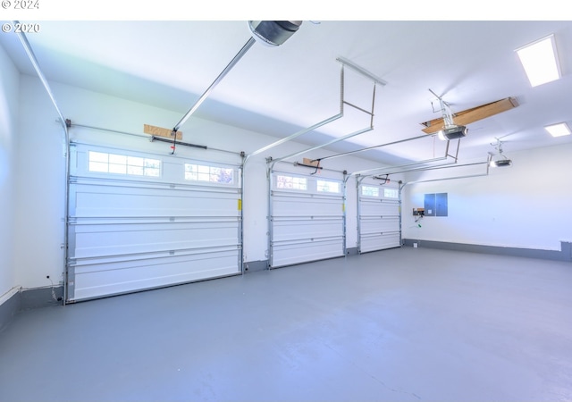 garage featuring electric panel and a garage door opener