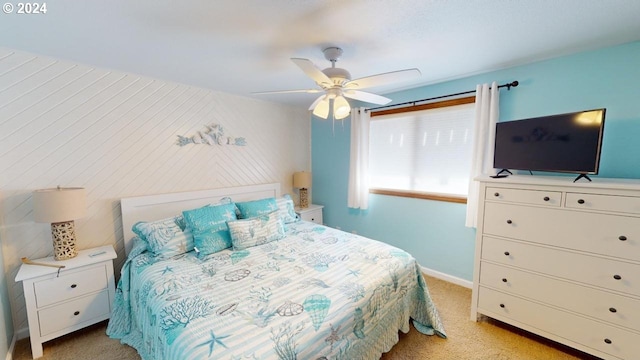 bedroom featuring ceiling fan and light carpet