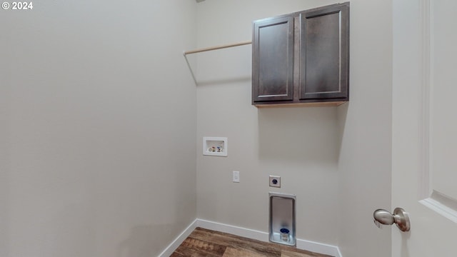 clothes washing area with cabinet space, baseboards, dark wood-style flooring, hookup for a washing machine, and electric dryer hookup