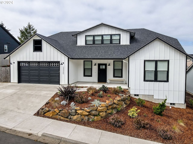 modern farmhouse featuring a garage