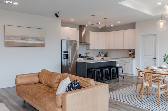 living room featuring wood-type flooring and sink