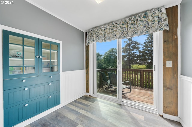 interior space with crown molding and wood-type flooring