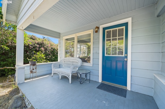 doorway to property featuring covered porch