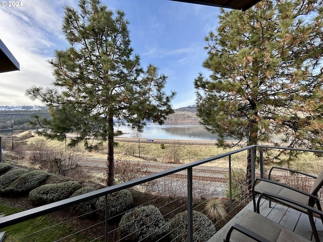 balcony featuring a water view