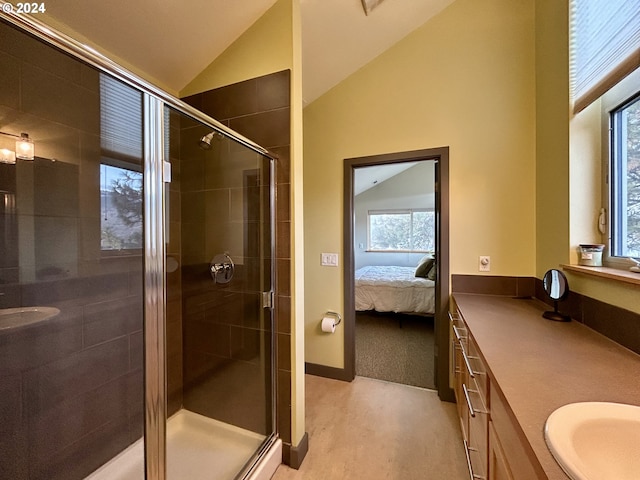 bathroom with vanity, an enclosed shower, and vaulted ceiling