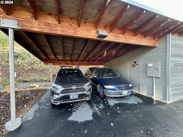 view of vehicle parking featuring a carport