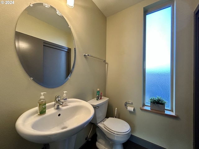 bathroom featuring toilet and sink