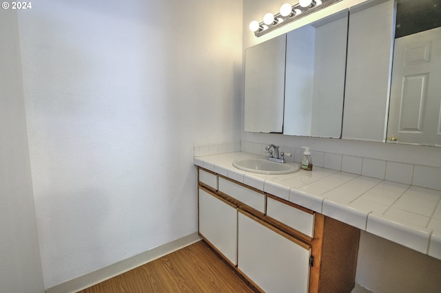 bathroom featuring wood-type flooring and vanity