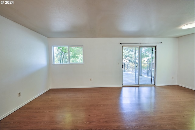 spare room with hardwood / wood-style floors