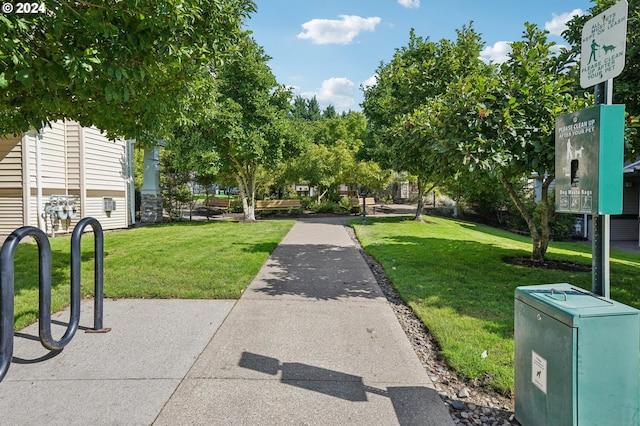 view of home's community featuring a lawn