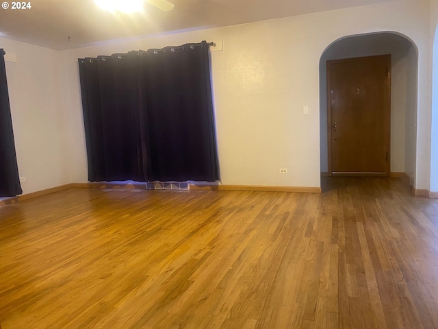 spare room featuring ceiling fan and light wood-type flooring