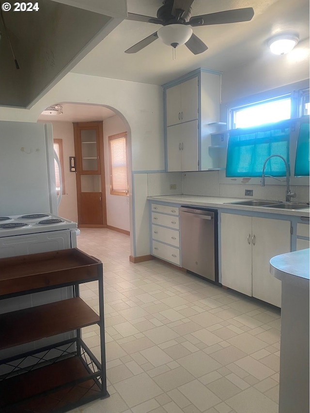 kitchen with white fridge, white cabinetry, sink, stainless steel dishwasher, and ceiling fan