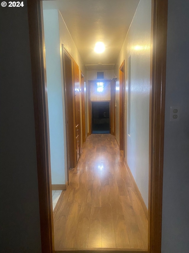 corridor featuring wood-type flooring