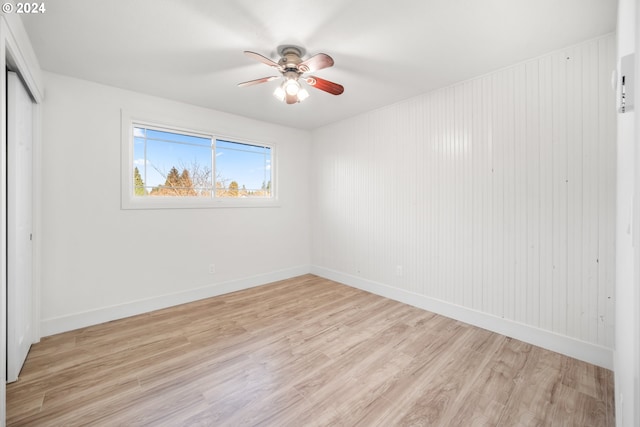 unfurnished room featuring ceiling fan and light hardwood / wood-style flooring