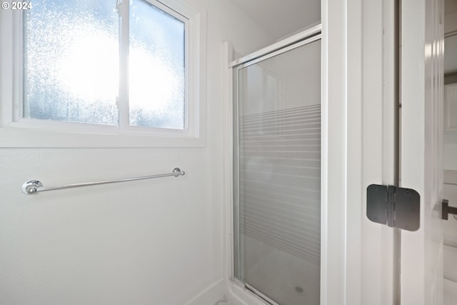 bathroom featuring an enclosed shower