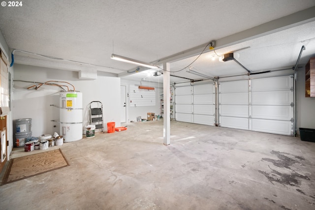 garage with a garage door opener and strapped water heater