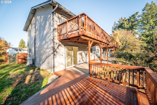 rear view of property with a wooden deck