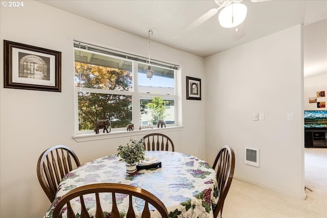 4744 W Powell Blvd Unit K227, Gresham, OR 97030 - dining area featuring a ceiling fan and light colored carpet