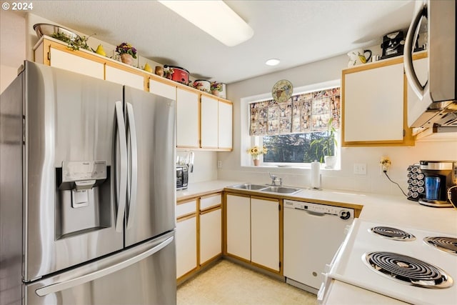 4744 W Powell Blvd Unit K227, Gresham, OR 97030 - kitchen with light countertops, a sink, and white appliances