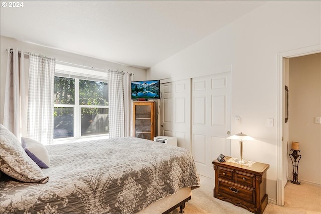 4744 W Powell Blvd Unit K227, Gresham, OR 97030 - bedroom with baseboards, light carpet, a closet, and vaulted ceiling