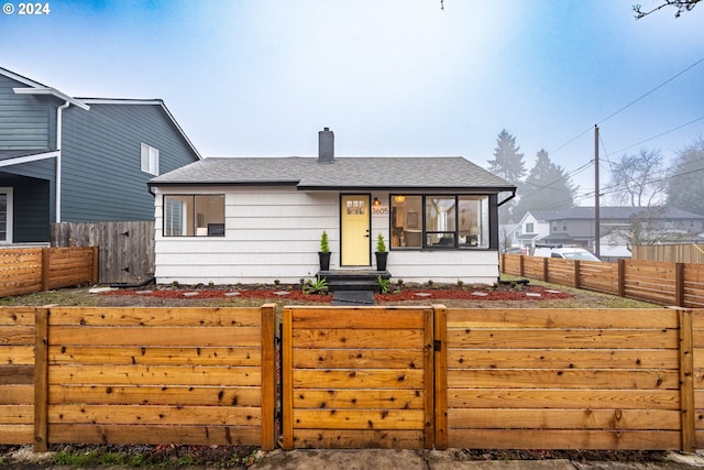 view of front of property featuring a sunroom