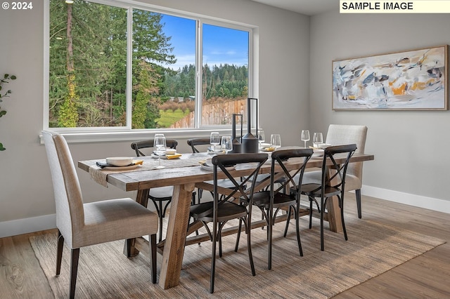 dining area featuring hardwood / wood-style floors and a wealth of natural light