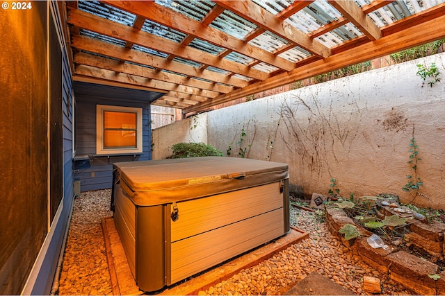 view of patio featuring a pergola and a hot tub