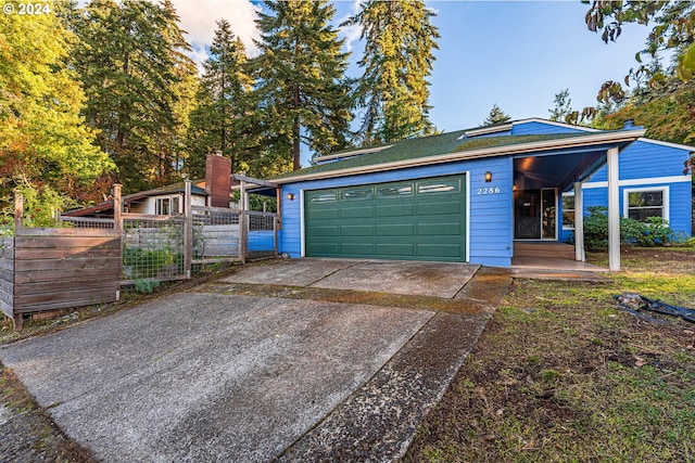 view of front of property with a garage