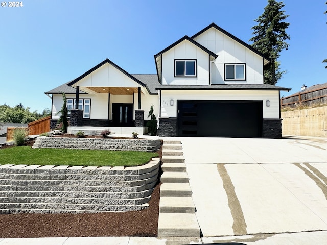 modern inspired farmhouse with covered porch and a garage