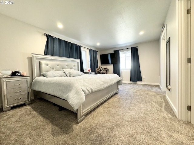 bedroom featuring light carpet