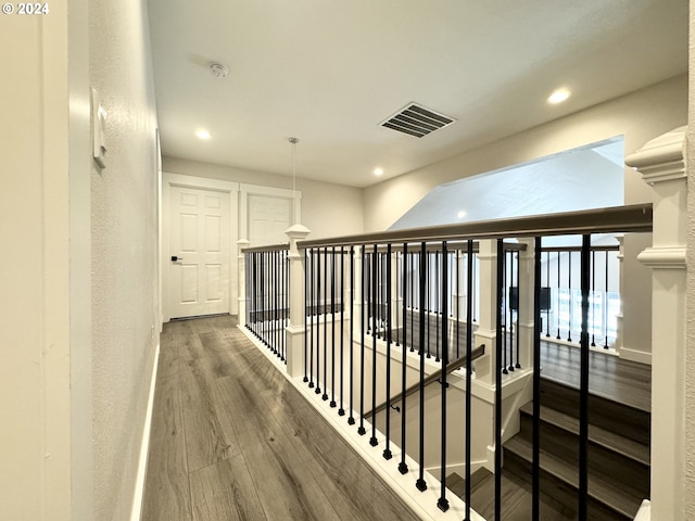 hallway featuring wood-type flooring