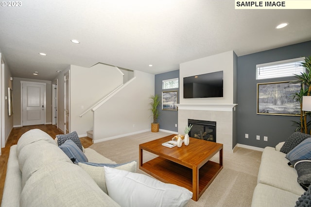 carpeted living room featuring a fireplace